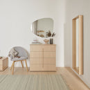 Grounded OMM oak dresser in a modern villa setting, highlighting the seamless architectural silhouette.