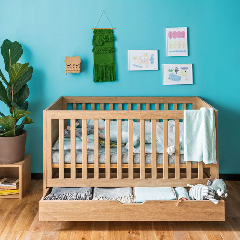 Cot bed with a bottom drawer for baby room